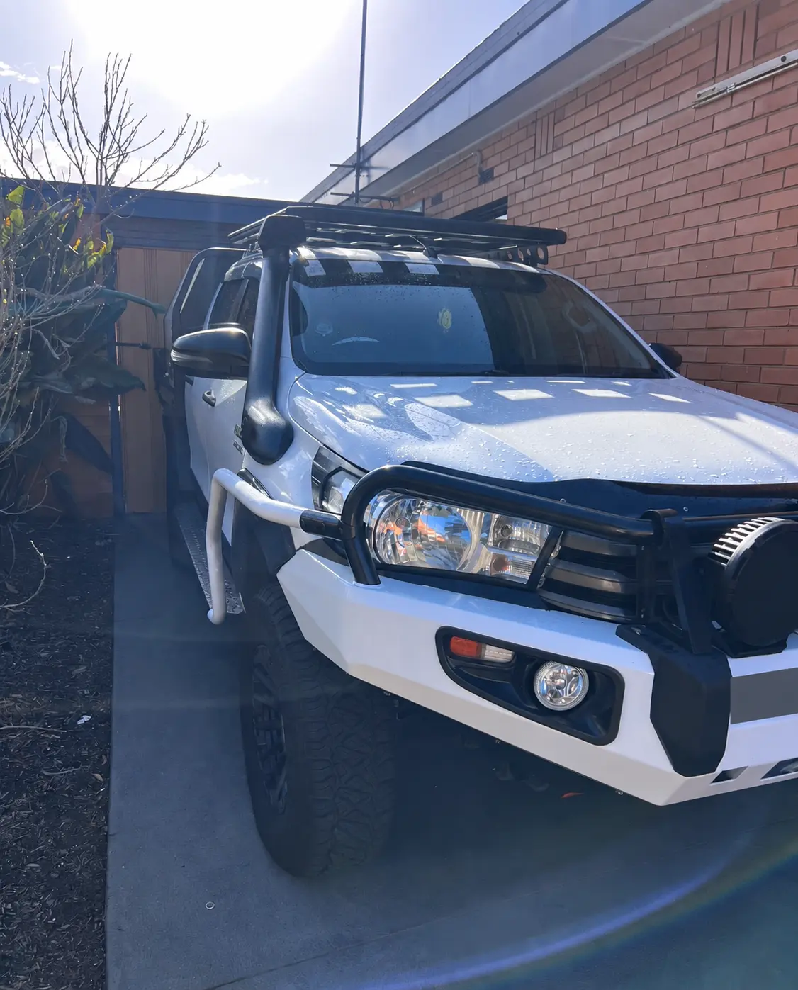 Bullbar positioned in front of the Toyota Hilux headlight