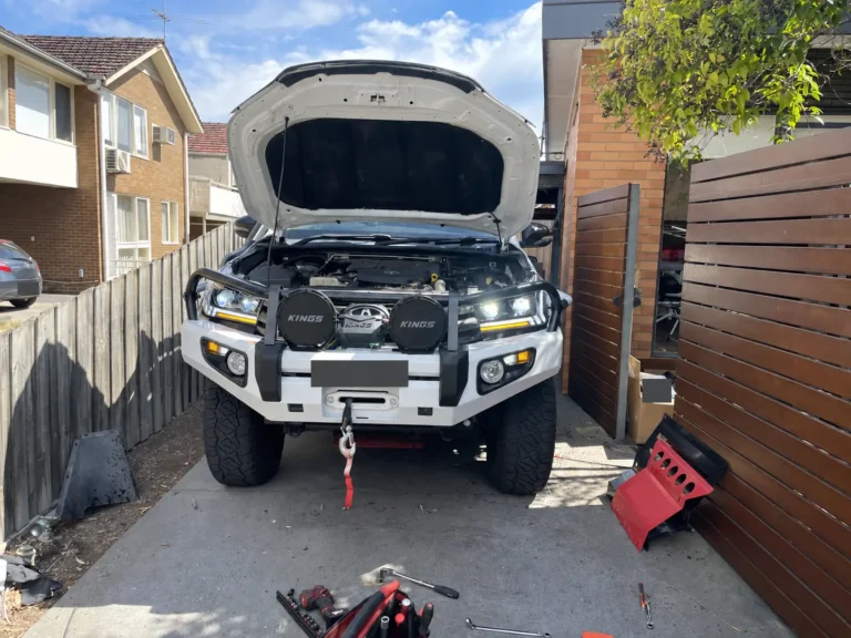 Toyota Hilux with upgraded headlights fitted behind its bullbar