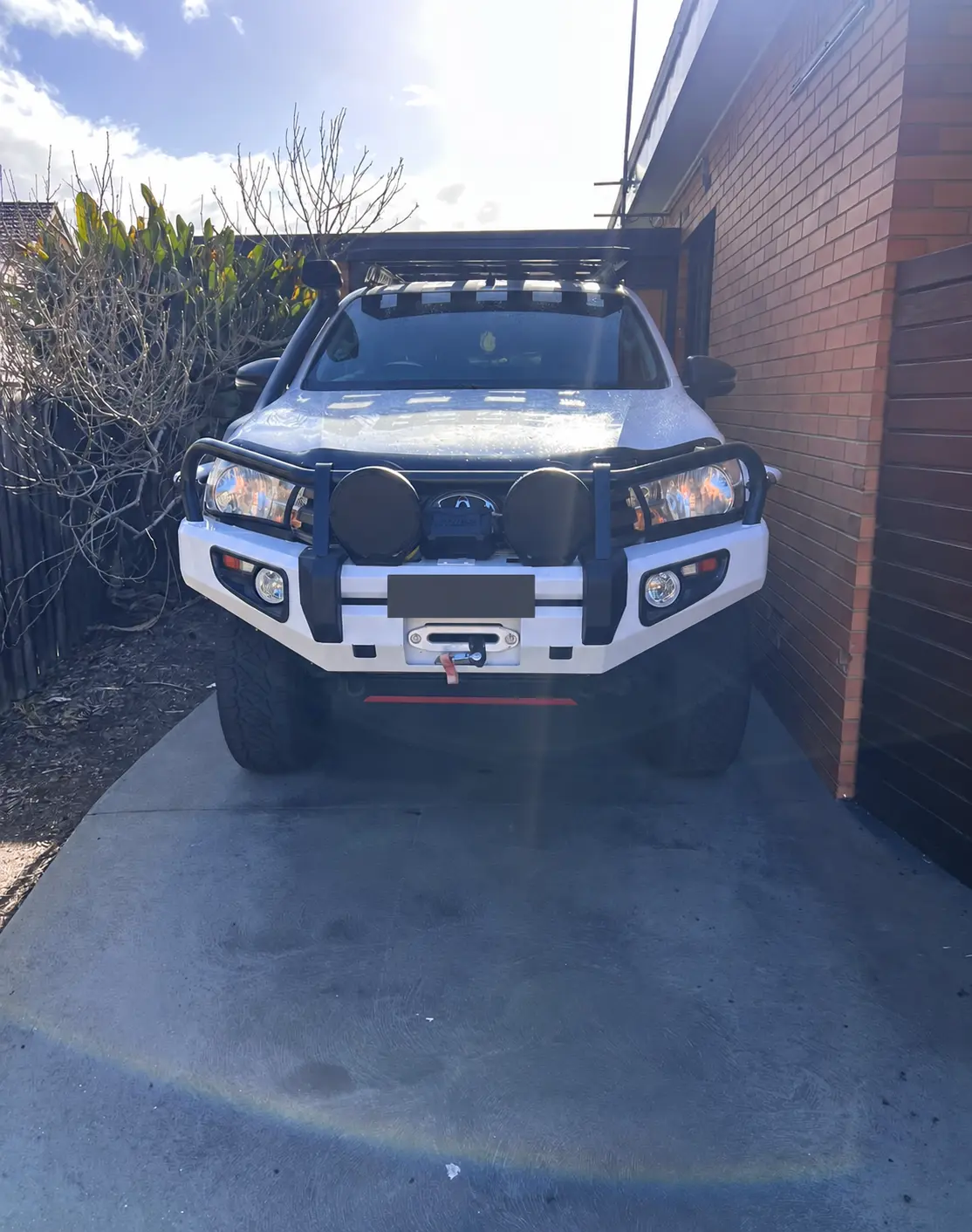 Toyota Hilux original headlights and bullbar before the upgrade