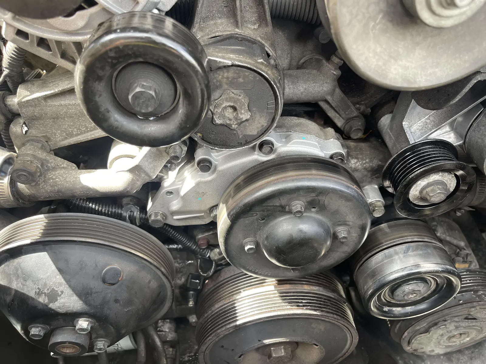 Replacement water pump installed behind the pulley on the Holden VX engine