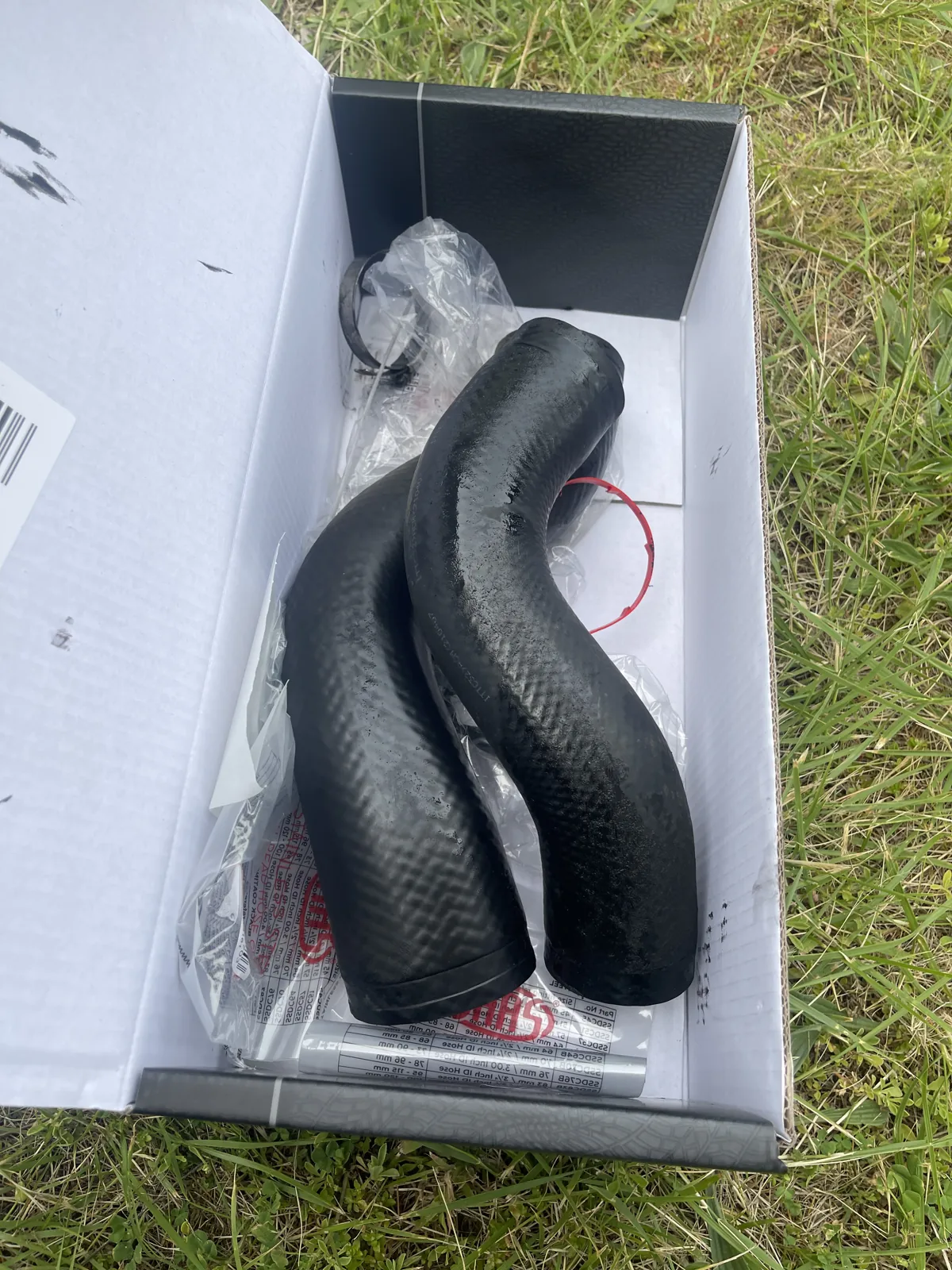 Two removed intercooler hoses from the Mitsubishi Triton 4N15 engine