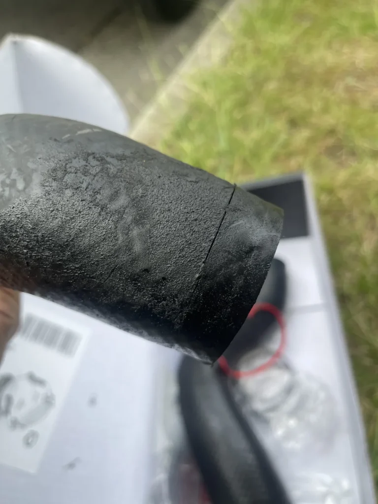 Close-up of the split near the end of the Mitsubishi Triton intercooler hose